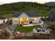 Back of house with nice patio, fire pit, landscaping, fence, and view of the mountain at 5225 Mesa Top Dr, Monument, CO 80132