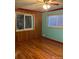 Bedroom with hardwood floors and two windows at 571 Geneva St, Aurora, CO 80010