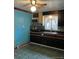 Dark kitchen cabinets, gas stove and microwave at 571 Geneva St, Aurora, CO 80010