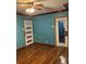 Living room with hardwood floors and two doors at 571 Geneva St, Aurora, CO 80010