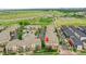 Aerial view of the community showing multiple apartment buildings near green spaces and highways at 3852 S Dallas St # 8-102, Aurora, CO 80014