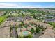 Aerial view of apartments featuring a pool, with surrounding community and green spaces at 3852 S Dallas St # 8-102, Aurora, CO 80014