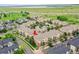 Aerial view of apartments featuring a pool, with surrounding community and green spaces at 3852 S Dallas St # 8-102, Aurora, CO 80014