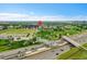 Aerial view of the community showing multiple apartment buildings near green spaces and highways at 3852 S Dallas St # 8-102, Aurora, CO 80014