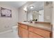 Bright bathroom featuring a vanity with a framed mirror, and decorative accents at 3852 S Dallas St # 8-102, Aurora, CO 80014