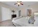 Spacious bedroom with soft carpet, neutral colored walls, and a bed topped with cozy throw blankets and pillows at 3852 S Dallas St # 8-102, Aurora, CO 80014