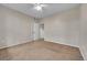 Neutral bedroom with soft carpet, light colored walls, and a ceiling fan at 3852 S Dallas St # 8-102, Aurora, CO 80014