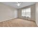 Clean and minimal bedroom with wall to wall carpeting and white walls at 3852 S Dallas St # 8-102, Aurora, CO 80014
