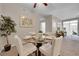 Chic dining room featuring a round table, four chairs, and bright natural light at 3852 S Dallas St # 8-102, Aurora, CO 80014