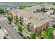 Exterior elevation of a multi-story apartment building showing architecture and street view at 3852 S Dallas St # 8-102, Aurora, CO 80014