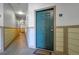 A bright condo hallway entrance with a neutral color palette and carpeted floors at 3852 S Dallas St # 8-102, Aurora, CO 80014