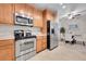 Modern kitchen with stainless steel appliances and ample countertop space at 3852 S Dallas St # 8-102, Aurora, CO 80014