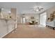 Spacious living room with bar seating, ceiling fan, and large windows at 3852 S Dallas St # 8-102, Aurora, CO 80014