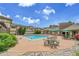 Community pool with lounge chairs and picnic area at 3852 S Dallas St # 8-102, Aurora, CO 80014
