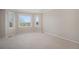 Serene bedroom featuring ample natural light, carpet, and scenic outdoor views at 102 Staghorn Way, Franktown, CO 80116