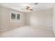 Bright bedroom with plush carpeting, and expansive windows offering an abundance of natural light at 102 Staghorn Way, Franktown, CO 80116