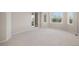 Bright bedroom with carpet flooring and a door leading to an outdoor area at 102 Staghorn Way, Franktown, CO 80116