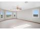 Spacious bedroom with large windows offering abundant natural light and scenic views at 102 Staghorn Way, Franktown, CO 80116