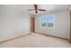 Bright bedroom features carpet, ceiling fan, trim work and window offering picturesque views at 102 Staghorn Way, Franktown, CO 80116