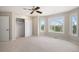 Cozy bedroom with closet, large windows offering views, and neutral carpet flooring at 102 Staghorn Way, Franktown, CO 80116