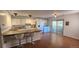 Eat-in kitchen area features light cabinets, hard surface counters, stainless steel appliances, and sliding door at 1847 Quail St # 10, Lakewood, CO 80215