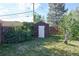 Backyard with a storage shed and mature trees, offering a private outdoor space at 6579 S Lincoln St, Centennial, CO 80121