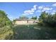 Spacious backyard features a lush lawn, mature trees, solar panels, and ample space to relax at 6579 S Lincoln St, Centennial, CO 80121