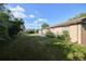 Large backyard with a lush lawn, mature trees, and space for outdoor activities at 6579 S Lincoln St, Centennial, CO 80121