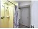 Bathroom with a shower and marble shower curtain, plus built-in wall storage at 6579 S Lincoln St, Centennial, CO 80121