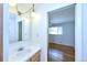 Bright bathroom with mirror and adjacent bedroom access at 6579 S Lincoln St, Centennial, CO 80121