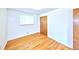 Bright bedroom with hardwood floors, natural light, and neutral walls at 6579 S Lincoln St, Centennial, CO 80121