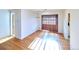 Sun-filled dining area featuring hardwood floors and wood shuttered window at 6579 S Lincoln St, Centennial, CO 80121
