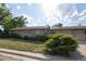 Charming single-story brick home with a well-manicured front yard and a covered front porch at 6579 S Lincoln St, Centennial, CO 80121