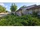 A cozy, brick one-story home with attractive landscaping, a small front porch and a well kept yard at 6579 S Lincoln St, Centennial, CO 80121