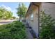 Charming brick one-story home features an inviting front porch and lush, mature landscaping at 6579 S Lincoln St, Centennial, CO 80121
