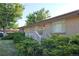 One-story brick home with lush, mature landscaping, bright sunny exposure, and a charming front porch at 6579 S Lincoln St, Centennial, CO 80121