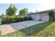Charming home with a multi car garage and a well-maintained front yard enhanced by mature trees and greenery at 6579 S Lincoln St, Centennial, CO 80121
