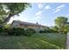 Charming single-story brick home with mature landscaping and inviting front porch at 6579 S Lincoln St, Centennial, CO 80121