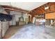 Spacious two-car garage with ample storage, workbench area and tv at 6579 S Lincoln St, Centennial, CO 80121