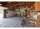 Two car garage with multiple work benches, open storage, and access to the backyard at 6579 S Lincoln St, Centennial, CO 80121