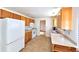 Traditional kitchen with matching cabinetry, appliances, and countertops at 6579 S Lincoln St, Centennial, CO 80121