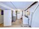 Functional laundry room with washer, dryer, and additional storage for convenience at 6579 S Lincoln St, Centennial, CO 80121