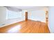 Bright living room features hardwood floors, window and fresh paint at 6579 S Lincoln St, Centennial, CO 80121