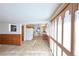 Spacious living area connecting to a kitchen with ample natural light at 6579 S Lincoln St, Centennial, CO 80121