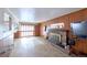 Living room with a brick fireplace, wood accents, and a large sliding glass door at 6579 S Lincoln St, Centennial, CO 80121