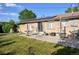 Lovely brick patio with seating, perfect for outdoor relaxation and enjoyment of the lush, green backyard at 6579 S Lincoln St, Centennial, CO 80121