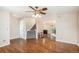 Hardwood floor living room with staircase and ceiling fan at 6500 E Asbury Ave, Denver, CO 80224