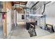 Unfinished basement featuring mechanical systems and a fire extinguisher at 9715 E 33Rd Ave, Denver, CO 80238