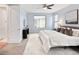 Serene bedroom with a large window overlooking the backyard, soft carpet, and a modern aesthetic at 9715 E 33Rd Ave, Denver, CO 80238