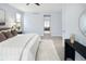 Relaxing bedroom with a king-size bed, neutral colors, and a view through to the en suite bathroom at 9715 E 33Rd Ave, Denver, CO 80238